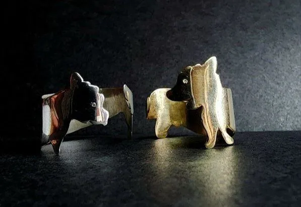 Silver and gold rings shaped as dog silhouettes